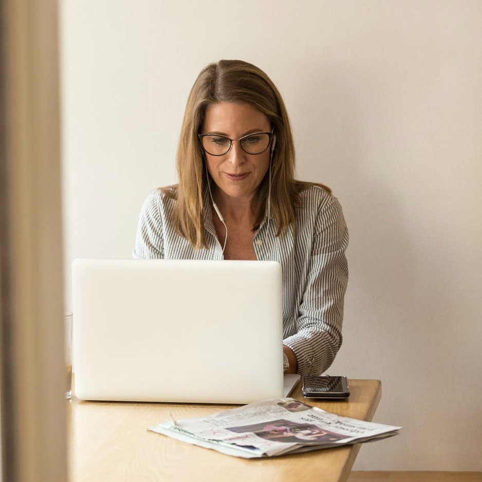 A woman working on her laptop.